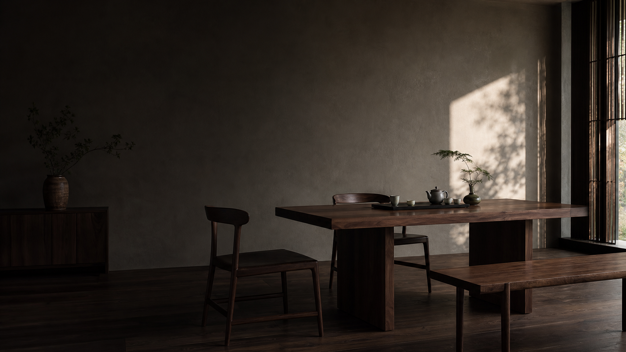 Black walnut furniture arranged in a calm tea and living space